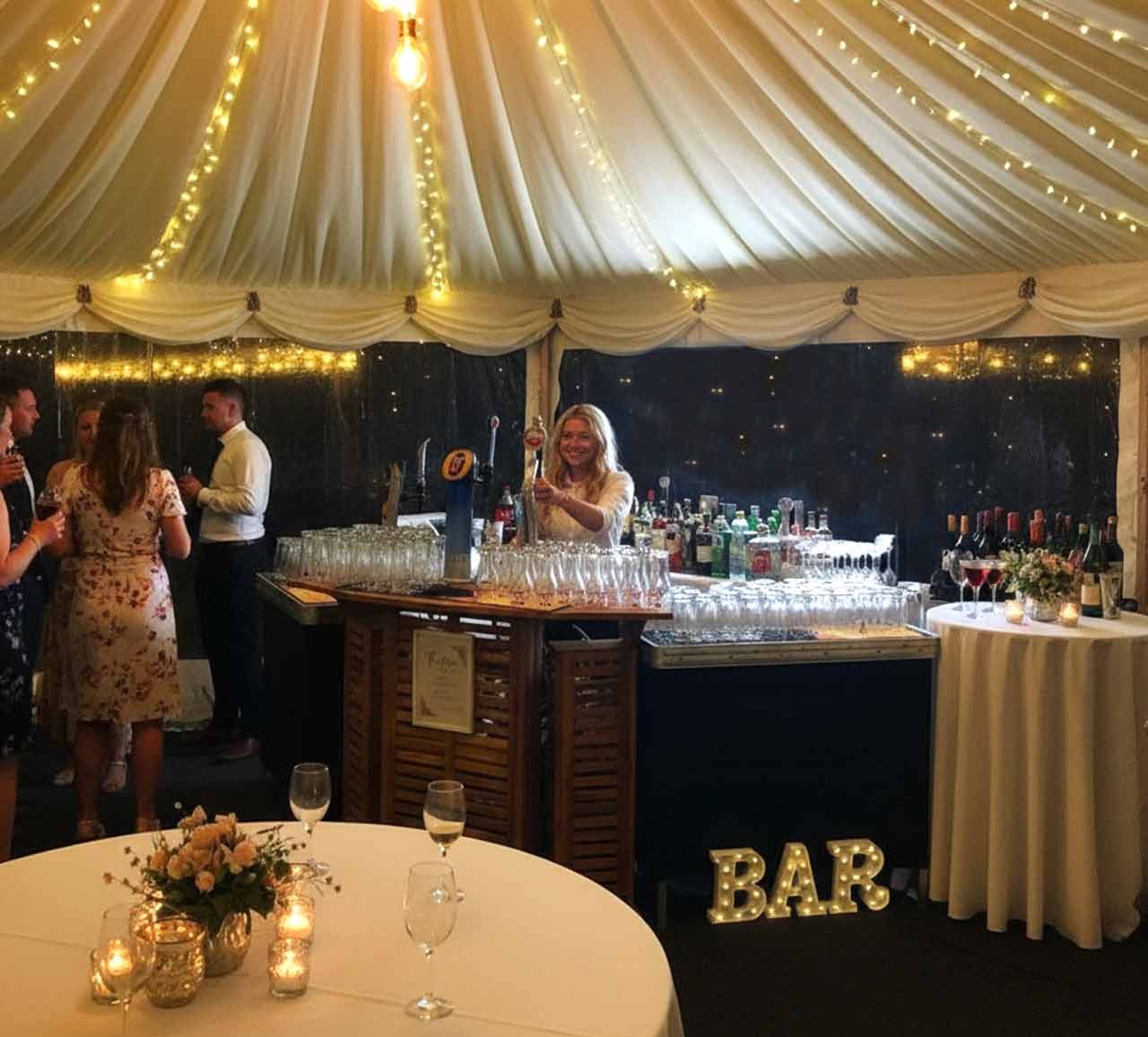 Barmaid serving for Free Mobile Bar at a marquee wedding reception in Richmond, County Durham